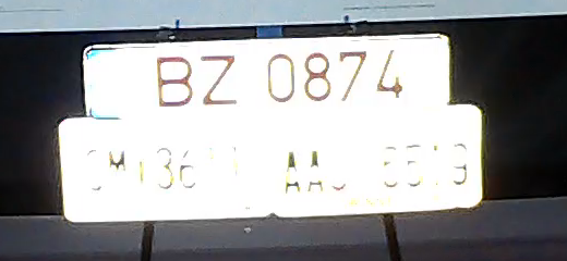 100 percent crop from the COXPAL A17D rear camera of the same three plates at the same second, the lower two blown into a white slab